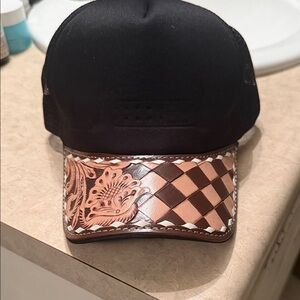 Hand tooled and hand painted leather trucker hat